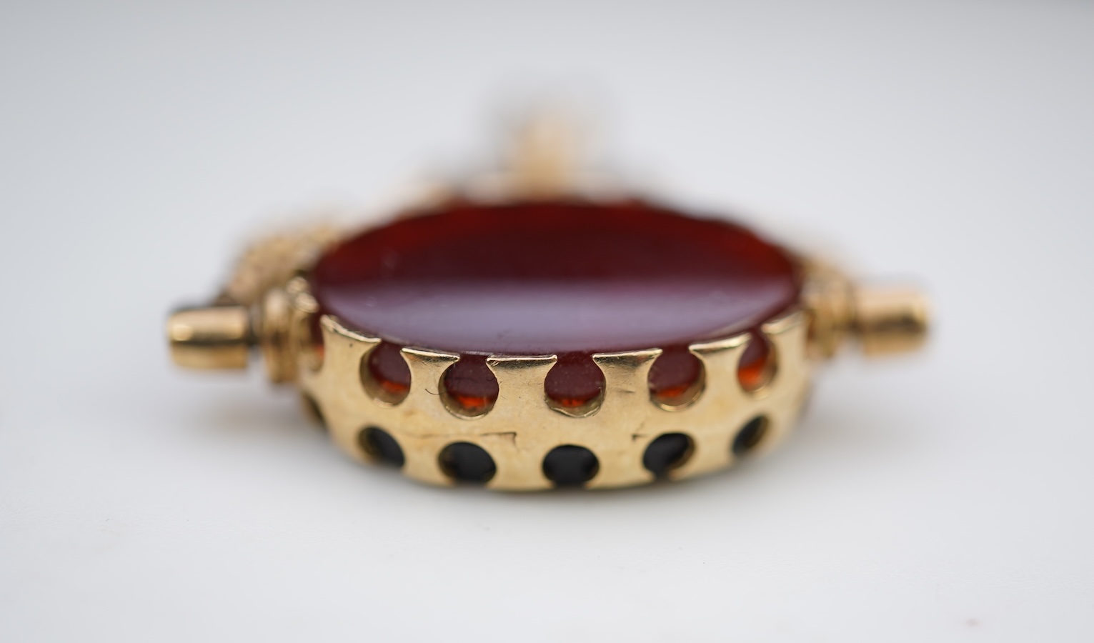 Three 9ct gold fob pendants